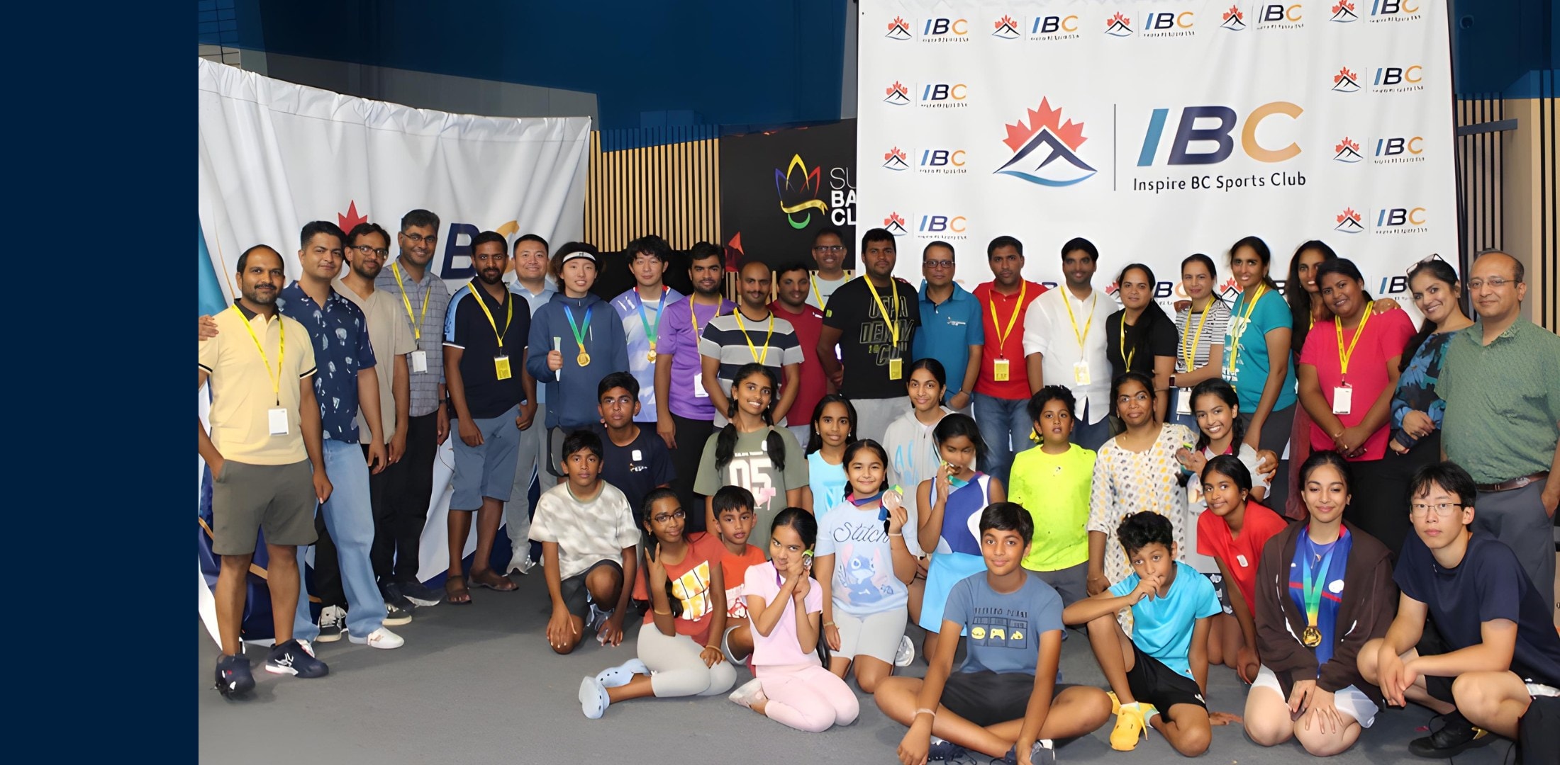 InspireBC Junior Badminton Tournament 2026 — full group photo of players, families and organizers
